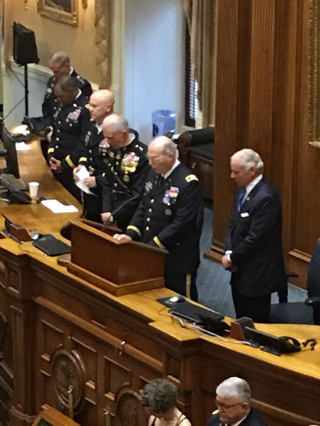Chaplain Colonel Hayes offering prayer in the South Carolina State House